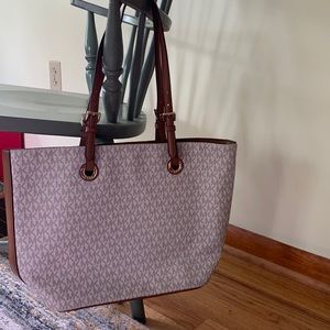 Large Michael Kors beige with brown straps.